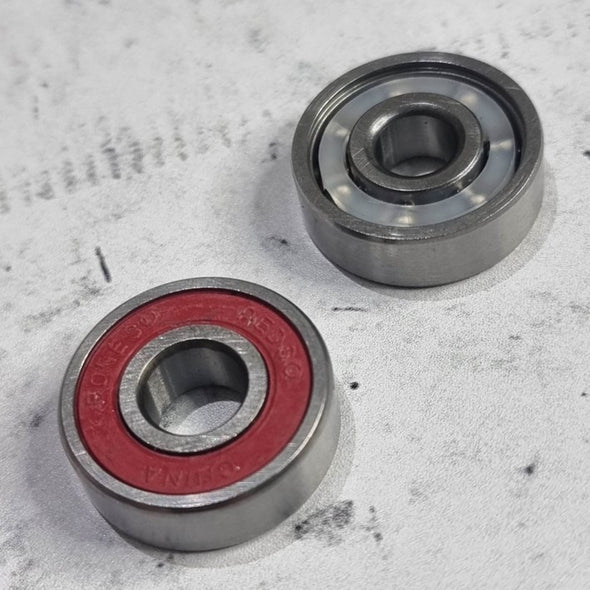 front and back of red shielded bearing