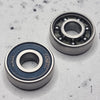 front and back of blue shielded skate bearing