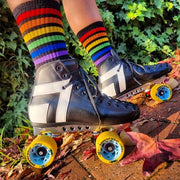 person wearing antik AR2 in rainbow socks with yellow morph solo wheels