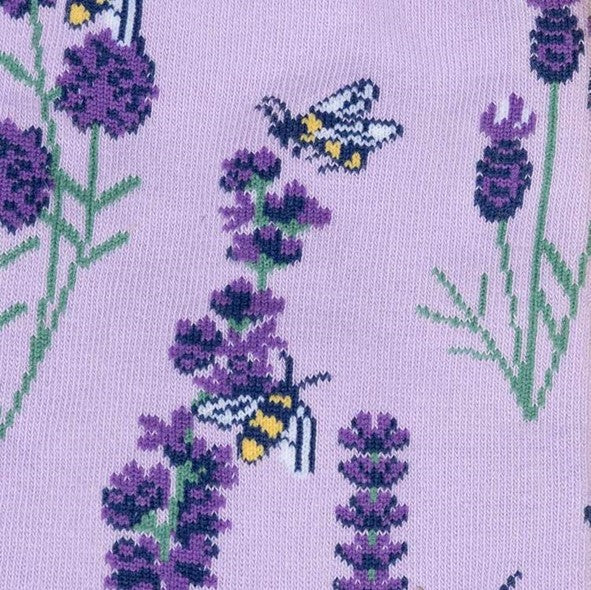 close up of lilac knee high socks with lavender plant and bees pattern