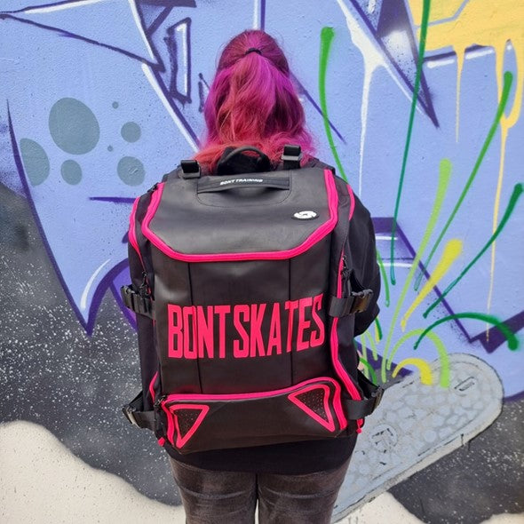 person carrying bont backpack black and pink