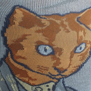 CLOSE UP OF KNEE HIGH SOCKS WITH PATTERN OF A CAT AS VAN GOGH SELF PORTRAIT