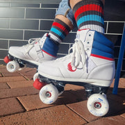 person wearing white sneaker park roller skate white wheels red toestops