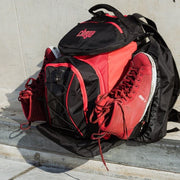 black red backpack holding chaya rollerskates