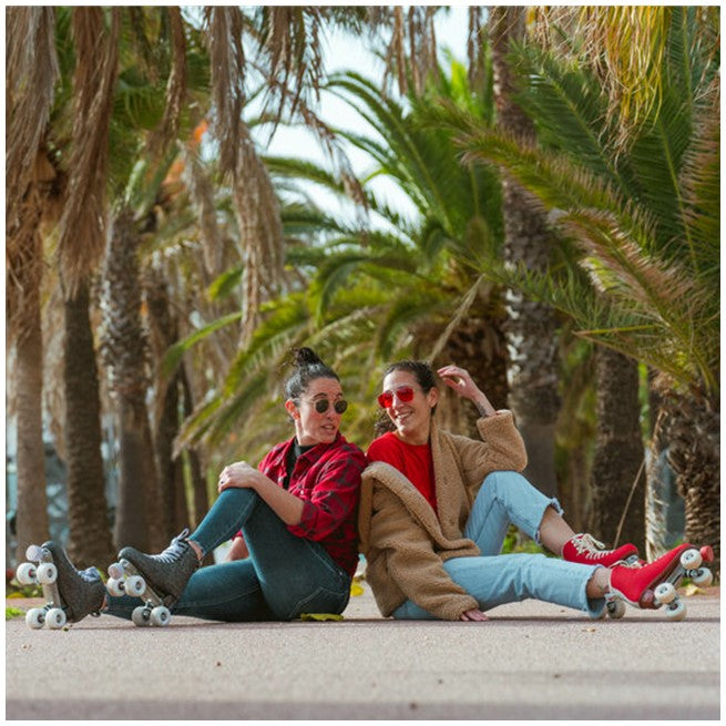 people wearing chaya black glitter and red high top rollerskates