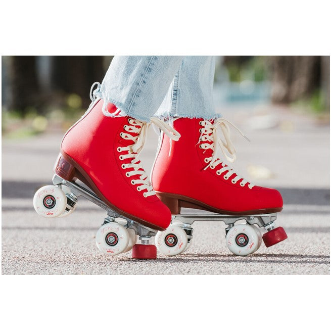 person wearing chaya red high top roller skates cream laces with outdoor white wheels red adjustable toe stop