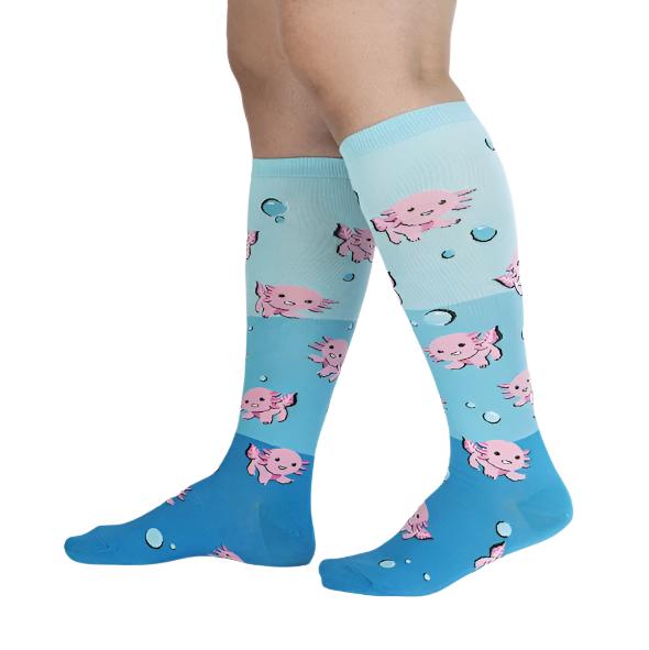 PERSON WEARING BLUE KNEE HIGH SOCKS WITH PATTERN OF PINK AXOLOTLS AND BLUE BUBBLES