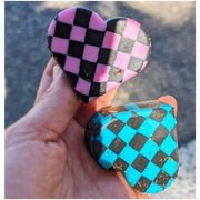 pink and teal checkered roller skate toe stops