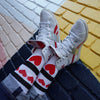 person wearing mid calf white socks with red love heartss 