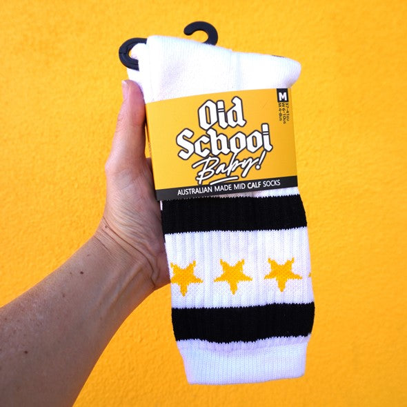 white mid calf skater socks with yellow stars