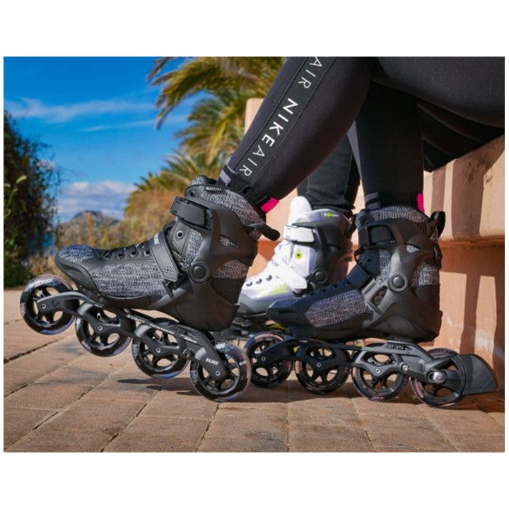 person waering black grey inline skates 