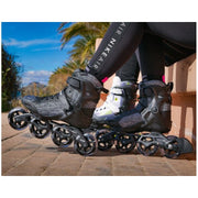 person waering black grey inline skates 