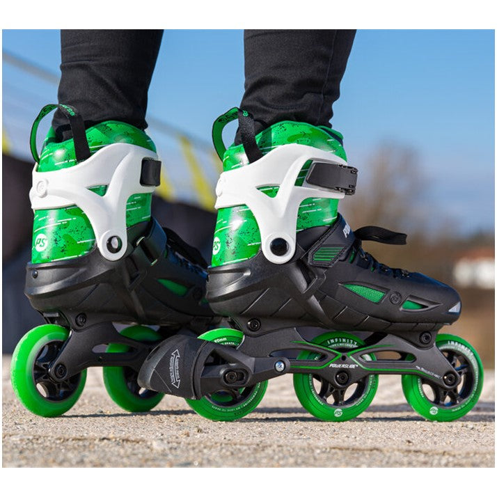 KID WEARING 3 WHEELED GREEN INLINE SKATES