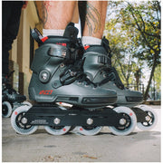 person wearing grey red urban inline skates with 90mm wheels 