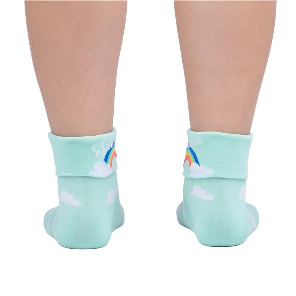 BACK VIEW OF PERSON WEARING MINT GREEN SOCKS