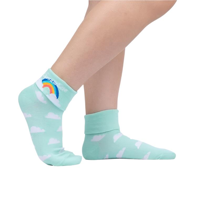 PERSON WEARING MINT SOCKS WITH CUFF DOWN WITH PATTERN OF CLOUDS 