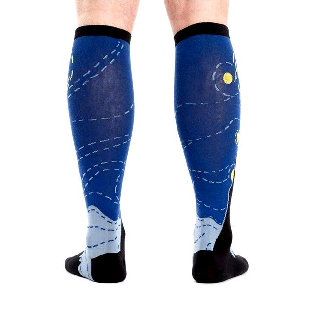 REAR VIEW OF PERSON WEARING KNEE HIGH SOCKS WITH PATTERN OF STARRY NIGHT PAINTING