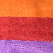 CLOSE UP OF RAINBOW STRIPE PATTERN ON SOCK