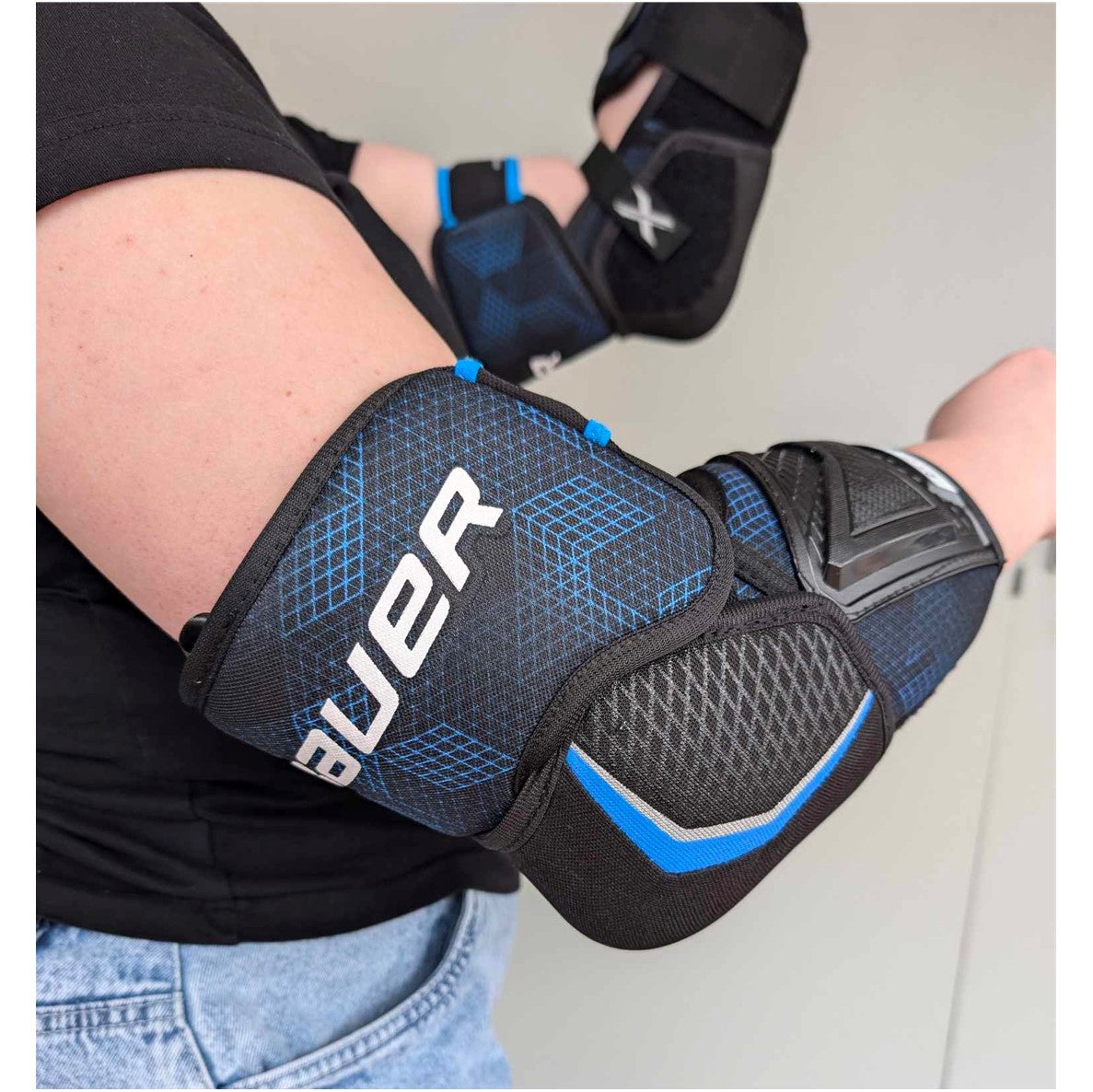 black blue hockey elbow protection 