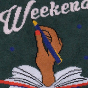 CLOSE UP OF DARK GREEN SOCK WITH HAND COMING OUT OF BOOK WRITING "WEEKEND"