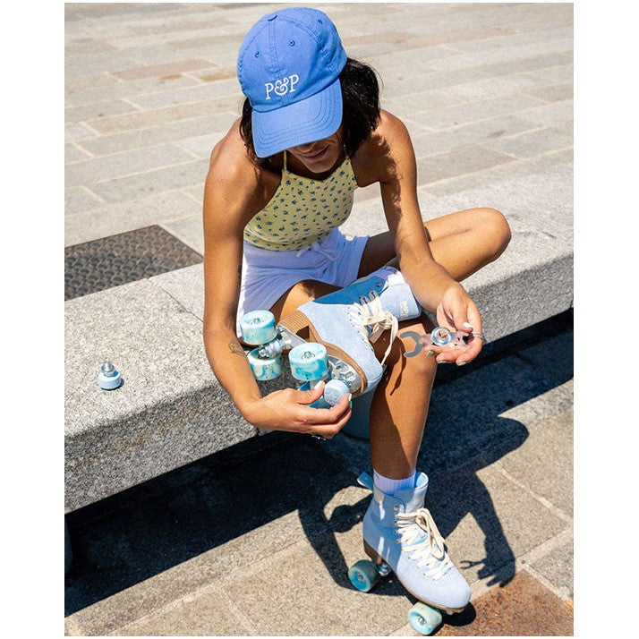 WOMEN wearing pastel blue suede high top imapala rollerskates