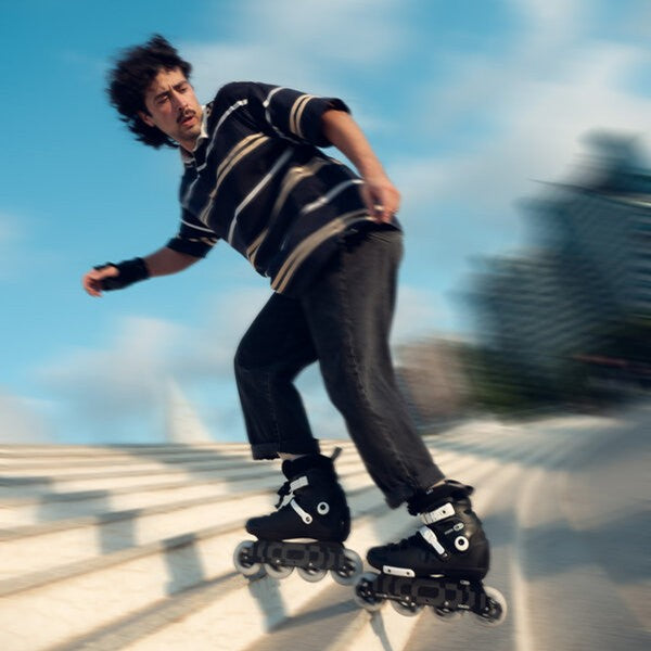 Person rollerblading outdoors with a blurred background