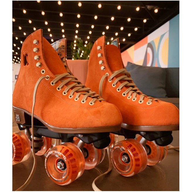 orange moxi roller skates with black powerdyne jam plugs in the toe stop 