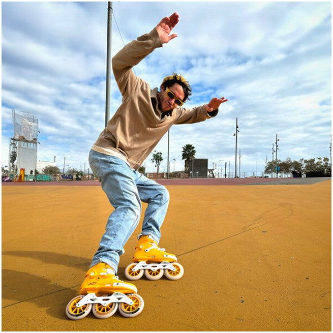 man wearing yellow inline skates