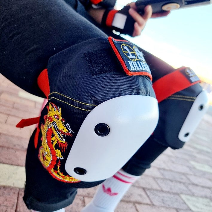 person wearing 187 dragon printed knee pad