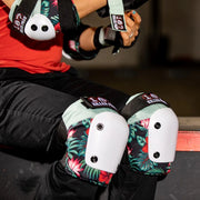 person wearing 187 green and floral knee and elbow pads