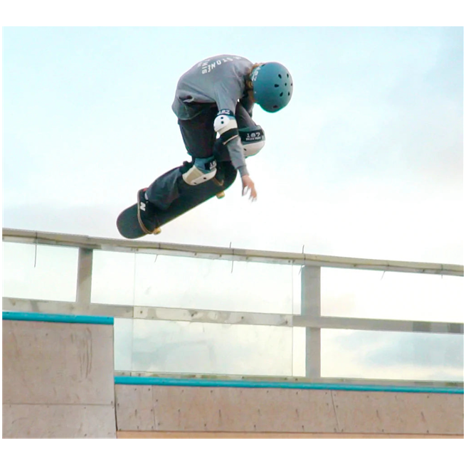 skateboarder wearing blue cream 187 killer knee pad and elbow pad set 