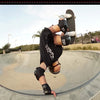 skateboarder on a skate ramp wearing the 187 killer pads black knee pads elbow pads and wrist guards