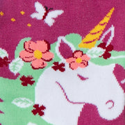 close up of unicorn with green hair and flowers on magenta sock