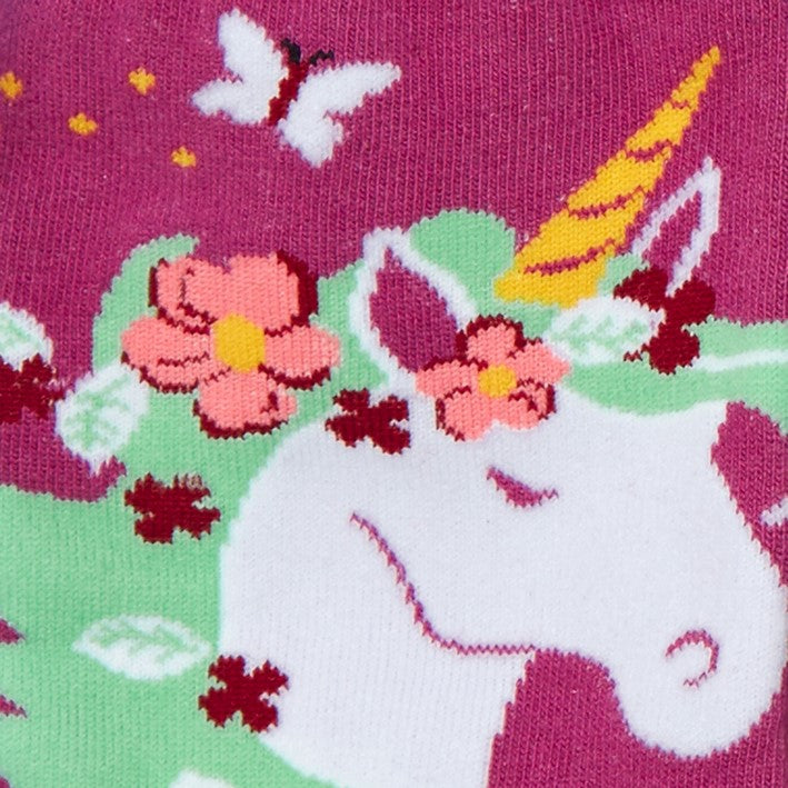 close up of unicorn with green hair and flowers on magenta sock