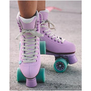 person wearing light purple chaya high top roller skates on road