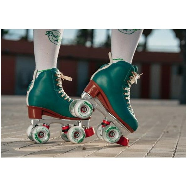 perso at skate park wearing chaya green high top roller skates 