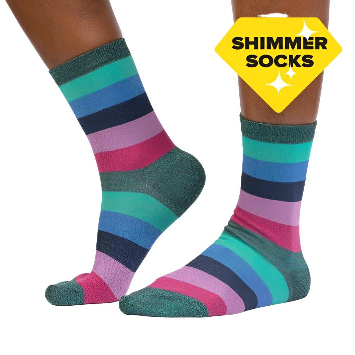 PERSON WEARING SPARKLY CREW SOCKS PINK GREEN AND BLUE STRIPED