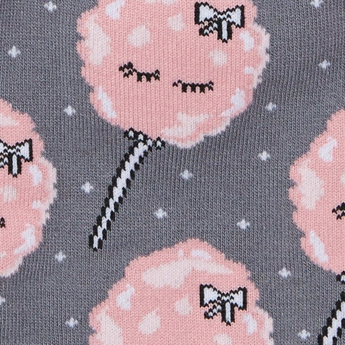 CLOSE UP OF FAIRY FLOSS PATTERN WITH SLEEPING EYES AND BOWS