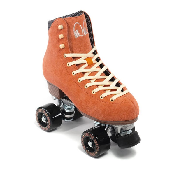 peach pink chuffed rollerskate with cream laces and black  outdoor wheels 