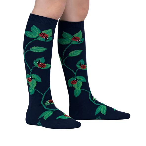 PERSON WEARING NAVY KNEE HIGH SOCKS WITH LEAF PATTERN AND LADY BUGS