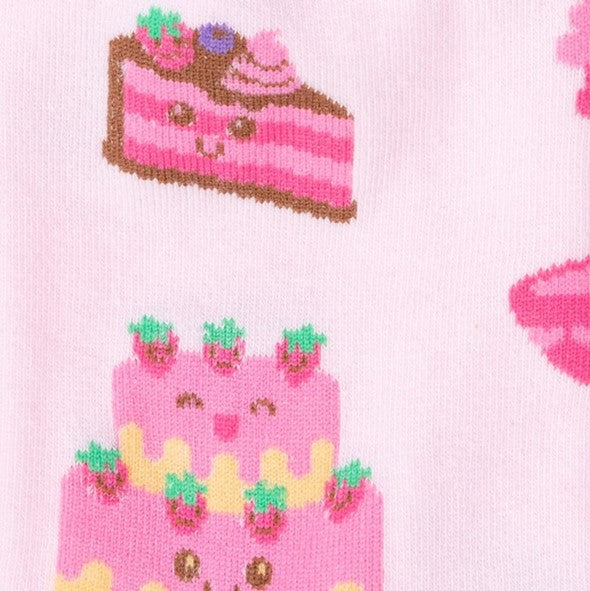 CLOSE UP OF BABY PINK CREW SOCKS WITH PATTERN OF CAKES WITH CUTE FACES