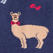 CLOSE UP OF NAVY BLUE CREW SOCKS WITH PATTERN OF LLAMAS WEARING BOWTIES