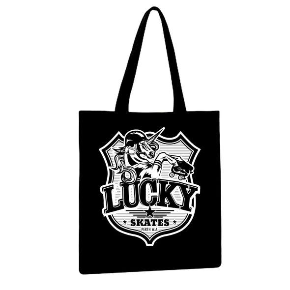 black tote bag with white unicorn printed on it and the text 'Lucky Skates'