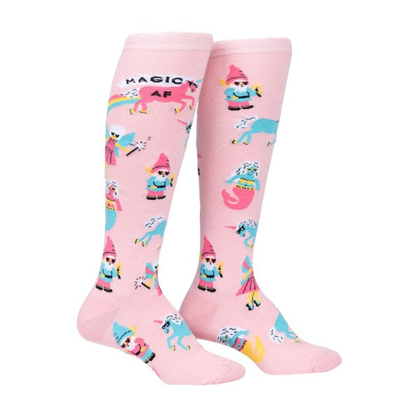  BABY PINK KNEE HIGH SOCKS WITH PATTERN OF UNICORNS FAIRYS AND GNOMES WITH GLASSES WITH TEXT "MAGIC AF"