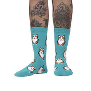 PERSON WEARING TEAL CREW SOCKS WITH PATTERN OF CORGIS