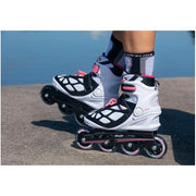 PERSON WEARING WHITE PINK INLINE SKATES ROLLERBLADES 