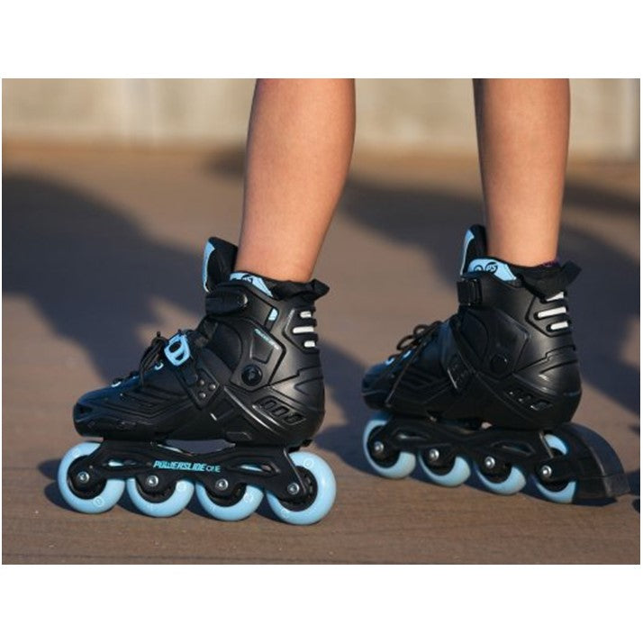 KID WEARING BLACK BLUE INLINE SKATES 