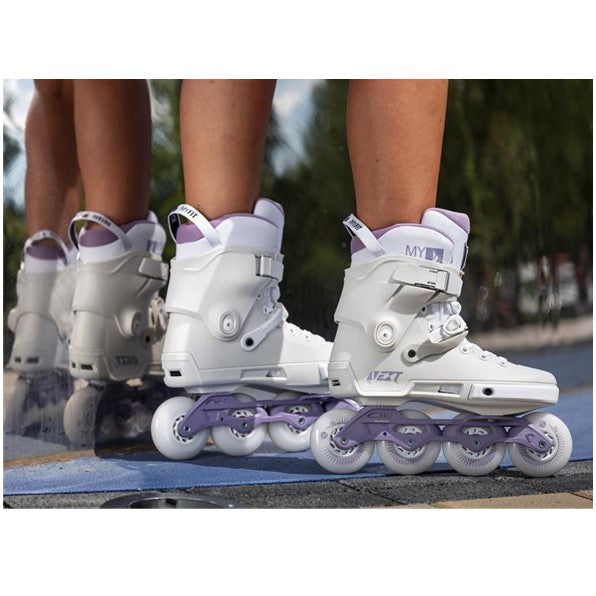 white inline skates with purple frames 