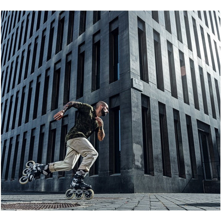 man skating in black white inline tri skates