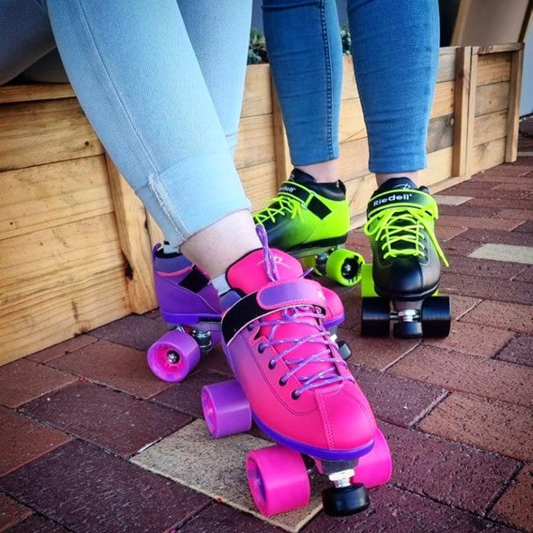 pink and purple ombre roller skates and green and black ombre skates 